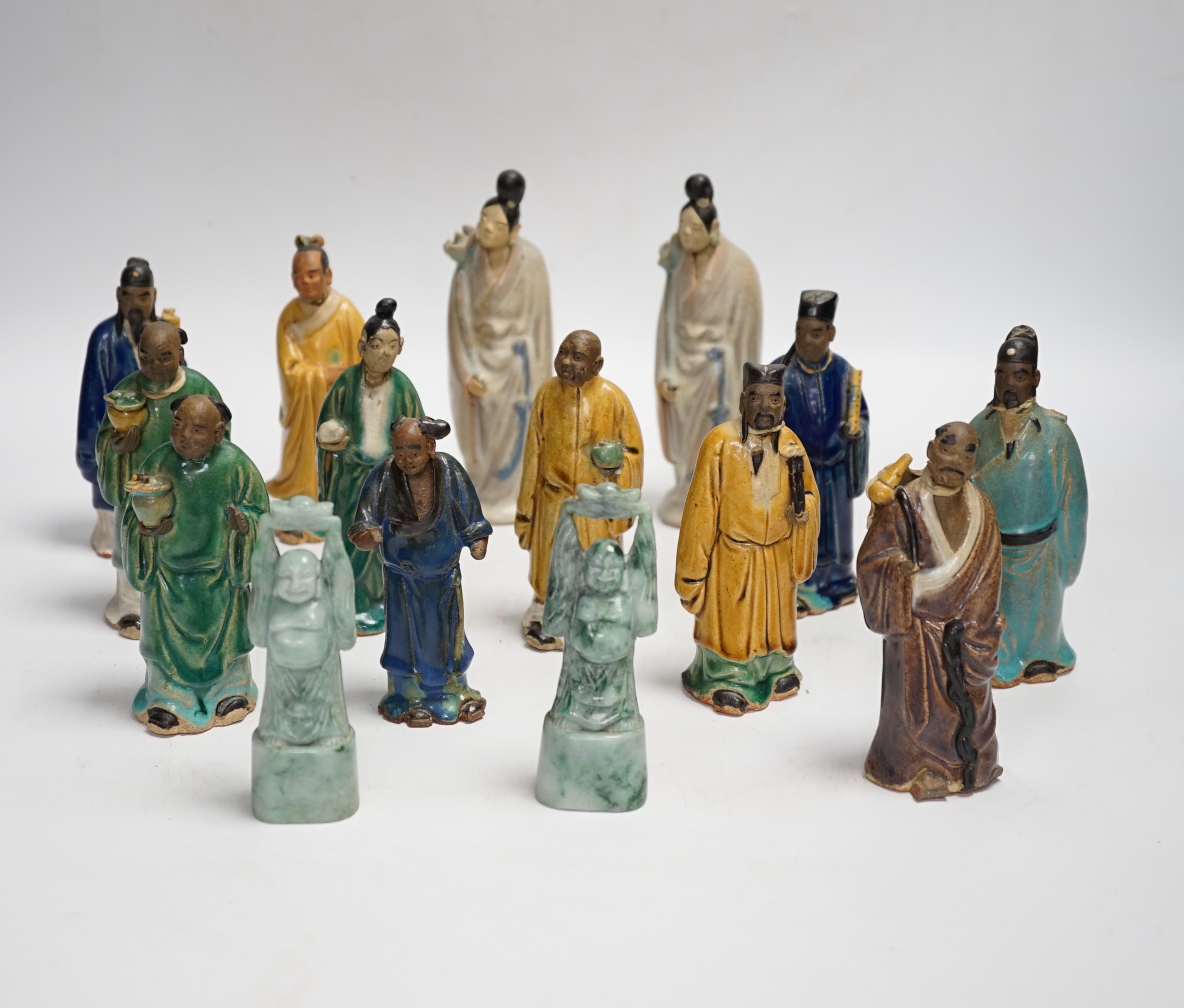Fifteen Chinese Shiwan-type glazed pottery figures and carved stone figures, early 20th century, tallest 15cm